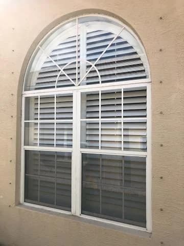 Installer working on a residential impact window opening
