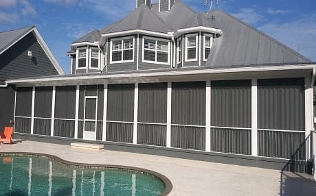 Accordion hurricane shutters protecting a Florida home